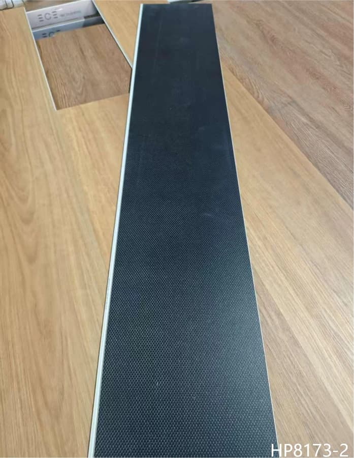 Warm oak SPC flooring plank and attached pad