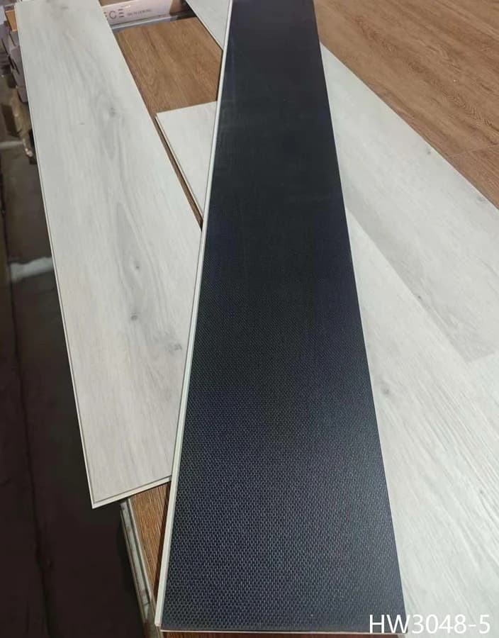 Coastal ash SPC flooring plank and attached pad