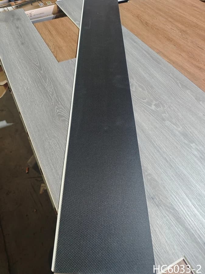 ProCraft SPC hybrid flooring plank showing the edge profile and attached pad