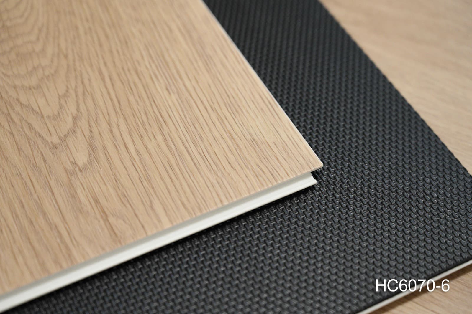 Stacked ProCraft planks showing the 7.5 mm board thickness