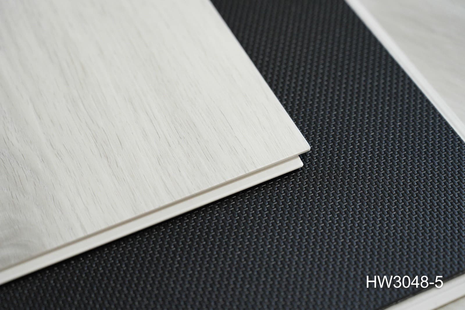 Stacked ProCraft planks showing the 7.5 mm board thickness